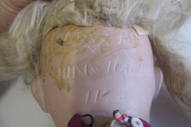 A Kammer & Reinhardt bisque socket head flirty doll Image