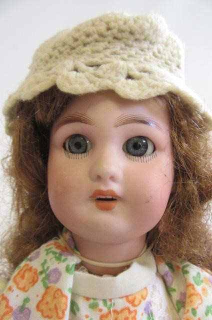 A French bisque socket head walking doll with blue glass fixed eyes Image