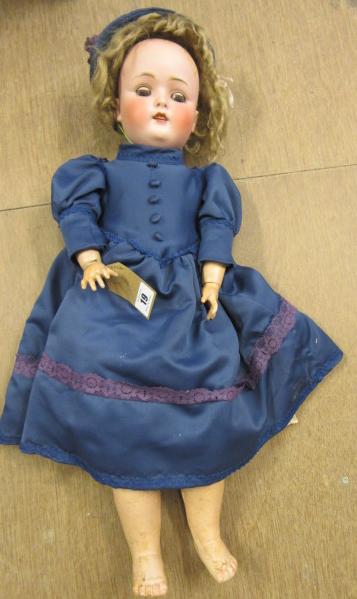 A Kestner bisque socket head doll with blue glass sleeping eyes Image