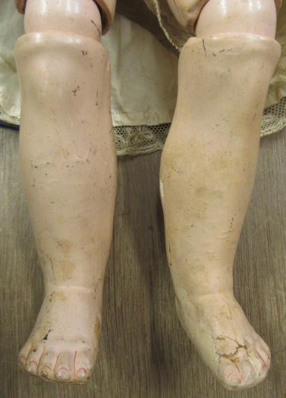 A Kestner bisque socket head doll with blue glass sleeping eyes Image