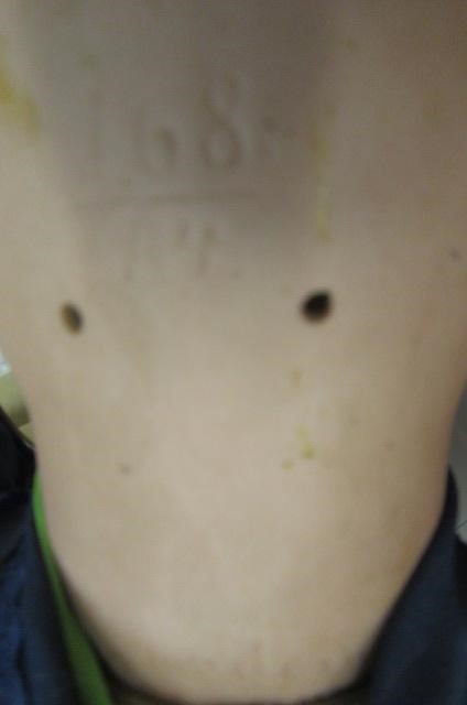 A Kestner bisque socket head doll with blue glass sleeping eyes Image