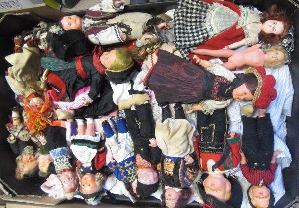 A large collection of national costume dolls Image