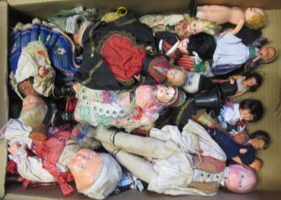 A large collection of national costume dolls Image