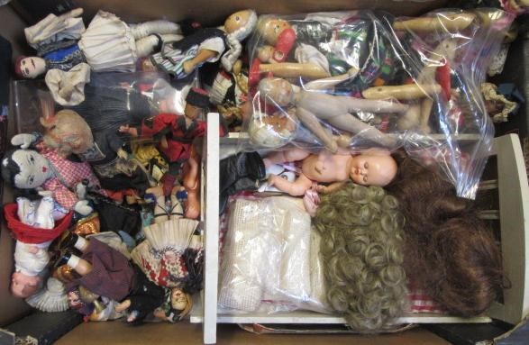 A large collection of national costume dolls Image