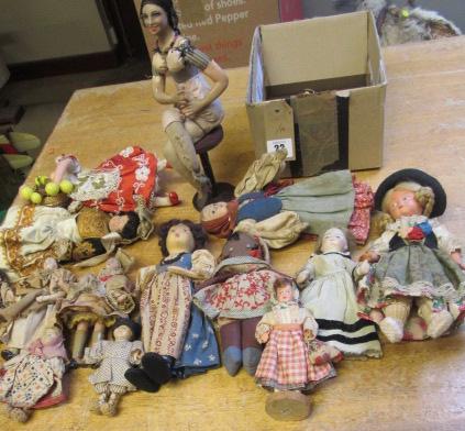 A collection of fourteen national costume and other small dolls including a Victorian German bisque Image