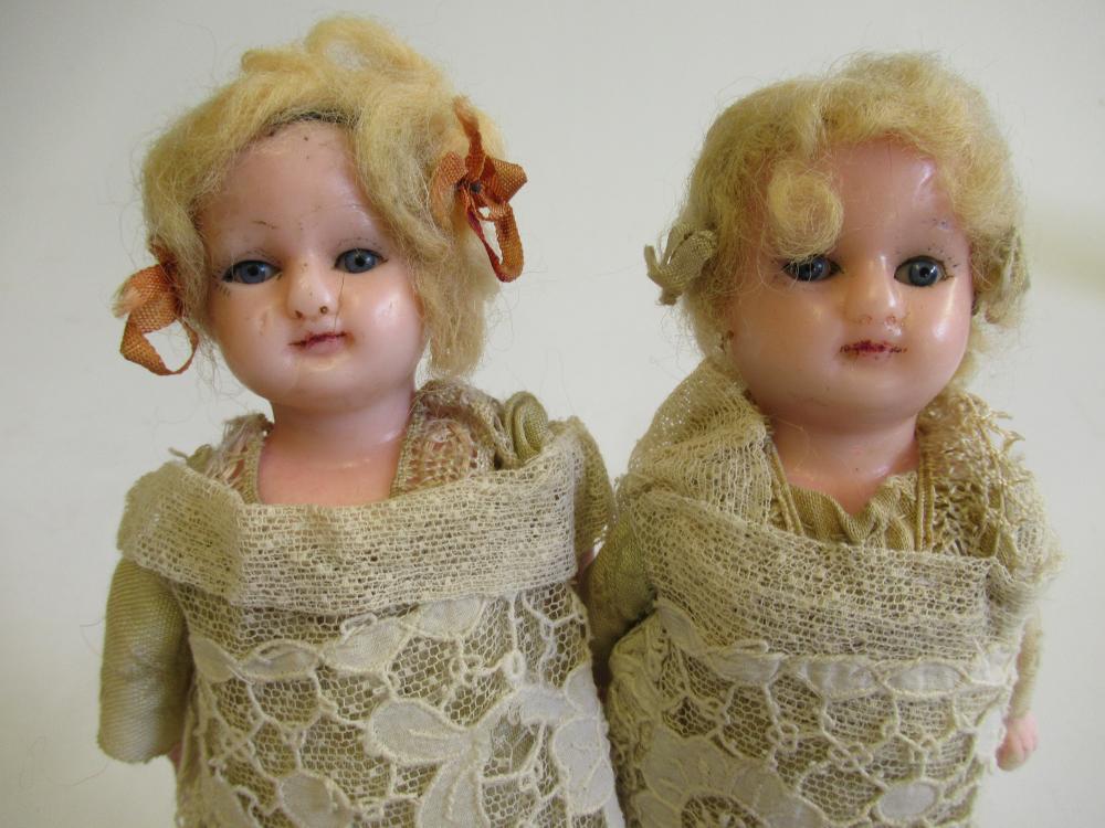 A pair of wax head and shoulder dolls Image