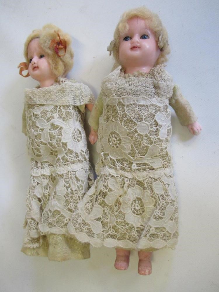 A pair of wax head and shoulder dolls Image