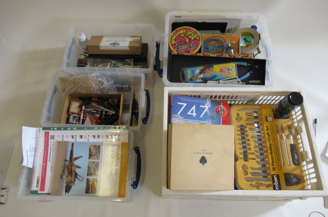 Five plastic boxes containing model making tools including paint Image