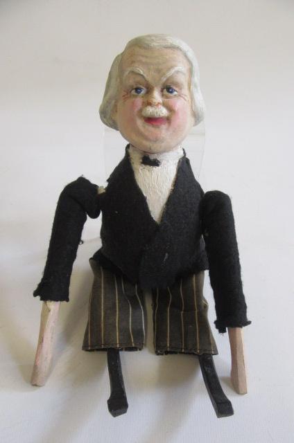A Lloyd George clockwork doll Image