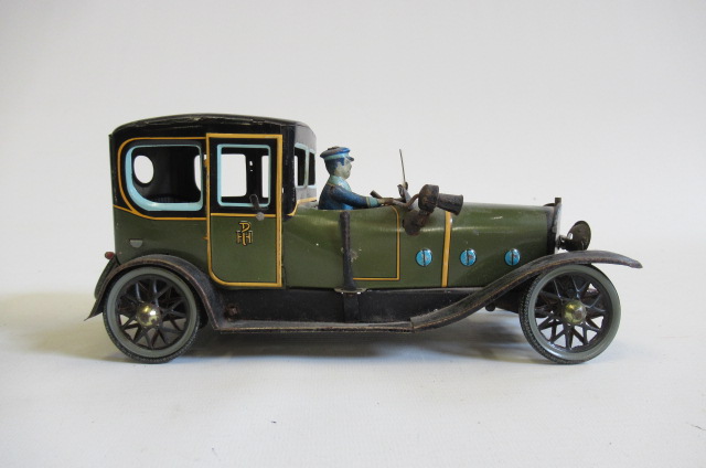 Paya clockwork town car finished in green and black with driver Image