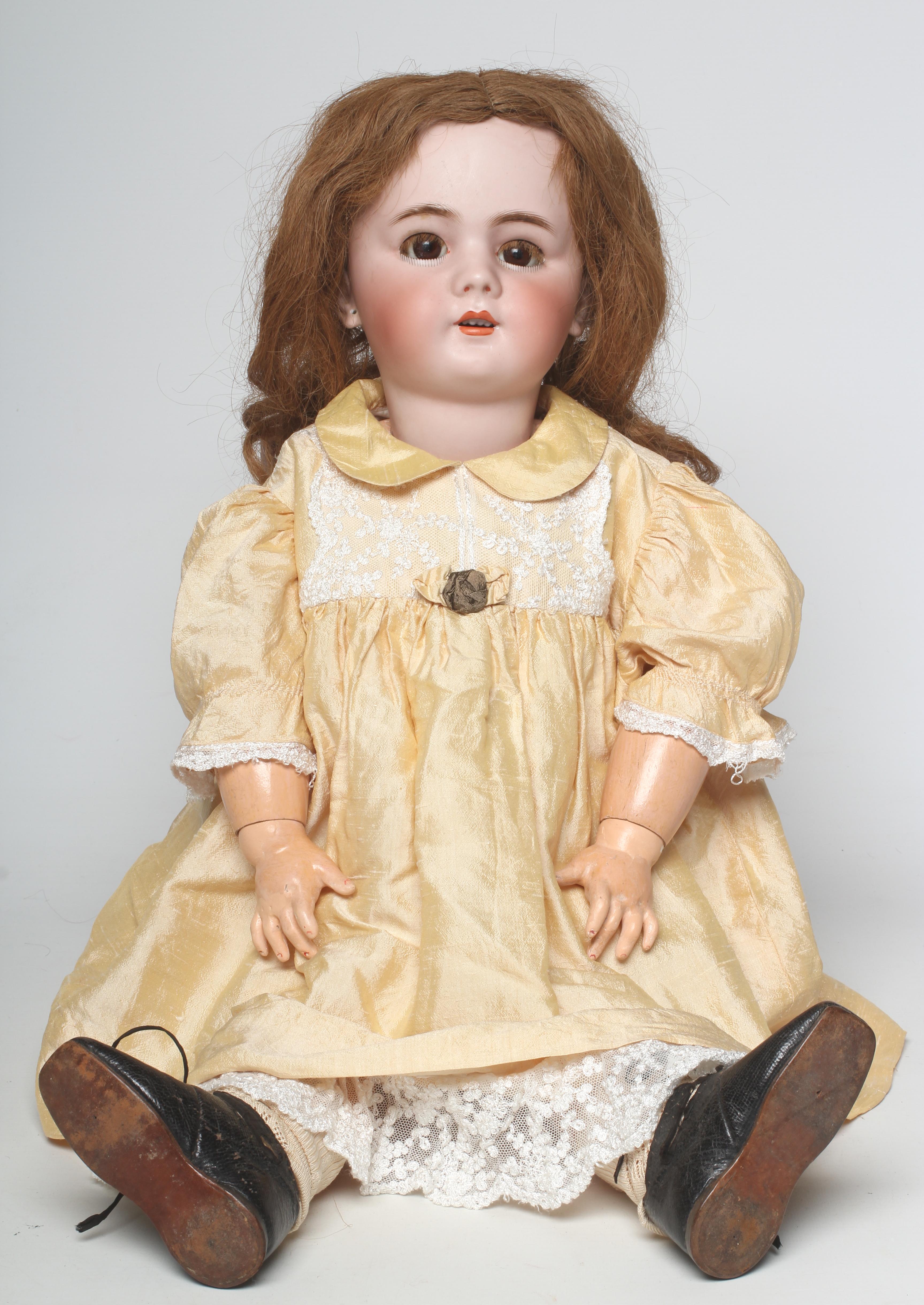 A Depose bisque socket head doll with brown glass sleeping eyes Image
