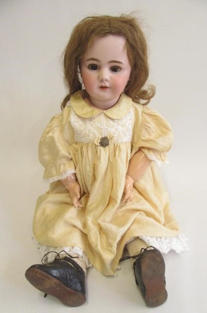 A Depose bisque socket head doll with brown glass sleeping eyes Image