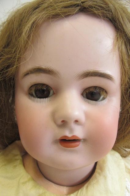 A Depose bisque socket head doll with brown glass sleeping eyes Image