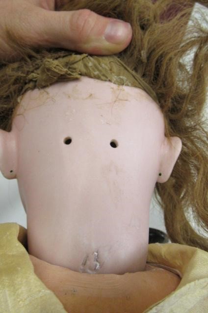 A Depose bisque socket head doll with brown glass sleeping eyes Image