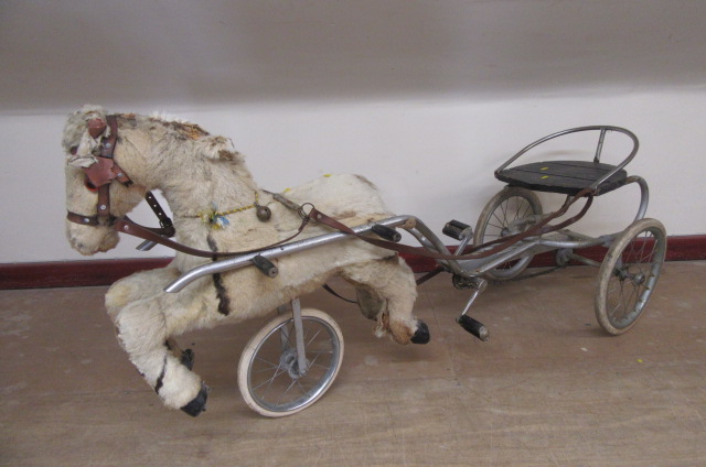 A sulky horse peddle trike Image