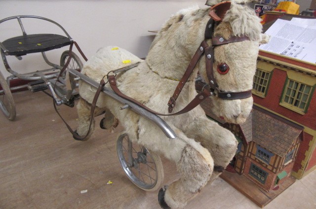 A sulky horse peddle trike Image
