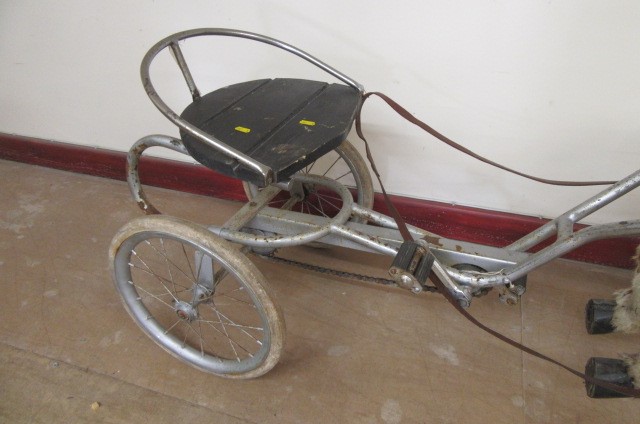 A sulky horse peddle trike Image