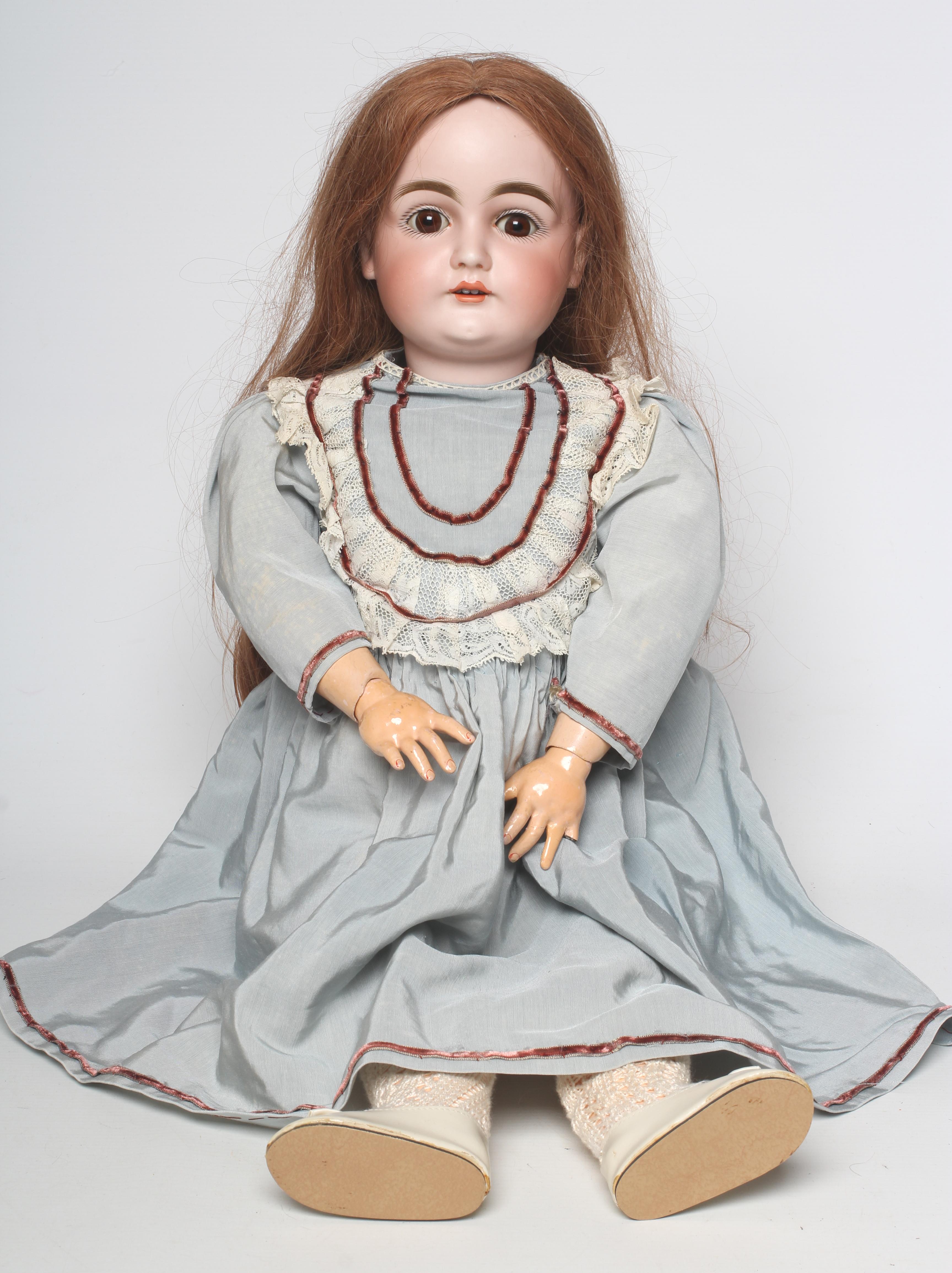 A Kestner bisque socket head doll with brown glass sleeping eyes Image