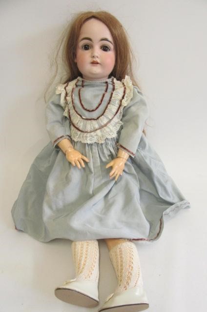 A Kestner bisque socket head doll with brown glass sleeping eyes Image