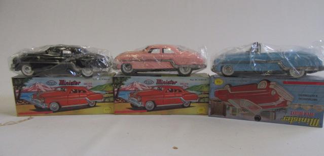 Three Minster Deluxe cars Image