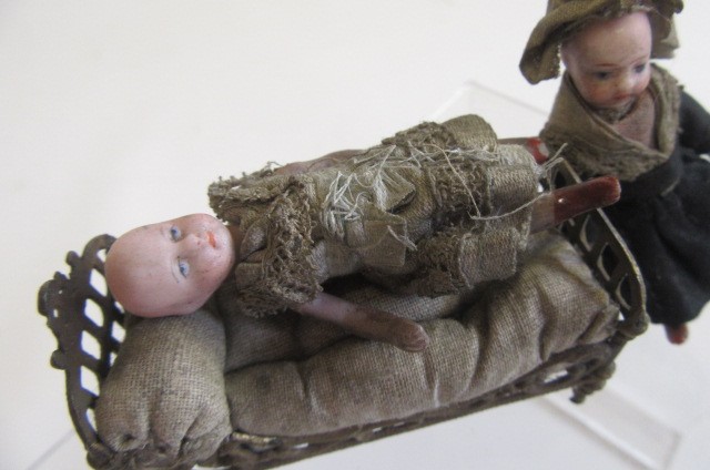 A pair of French all bisque dolls house dolls Image