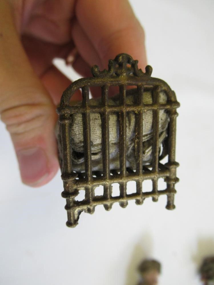 A pair of French all bisque dolls house dolls Image