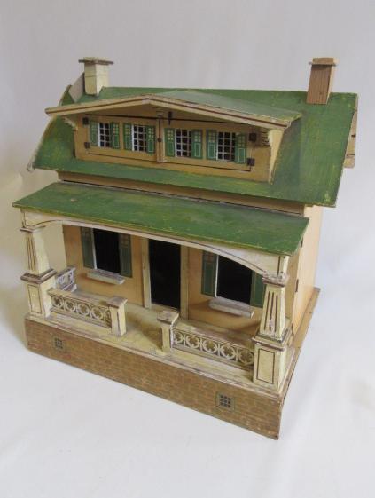 A rare pre-war "Moko" dolls house of painted wooden construction Image