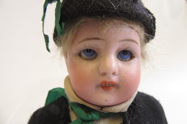 A Simon & Halbig bisque socket head boy doll with blue glass sleeping eyes Image