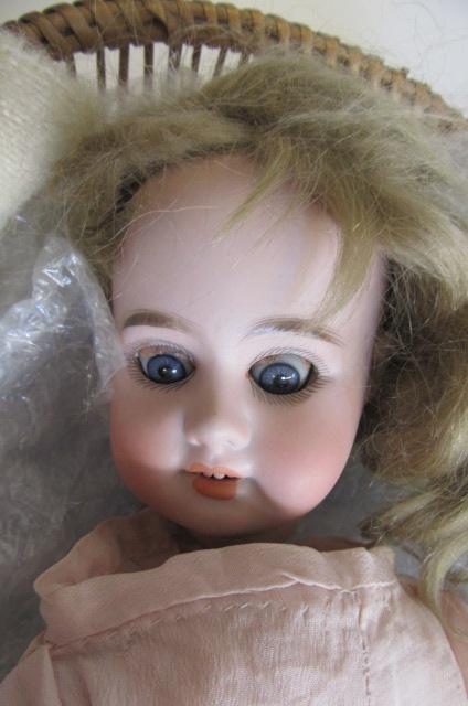 An Armand Marseille 1894 bisque socket head doll Image