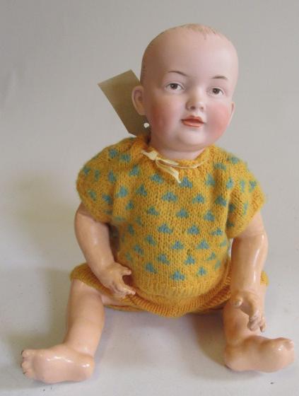 A Kley & Hahn bisque socket head baby doll with painted eyes Image