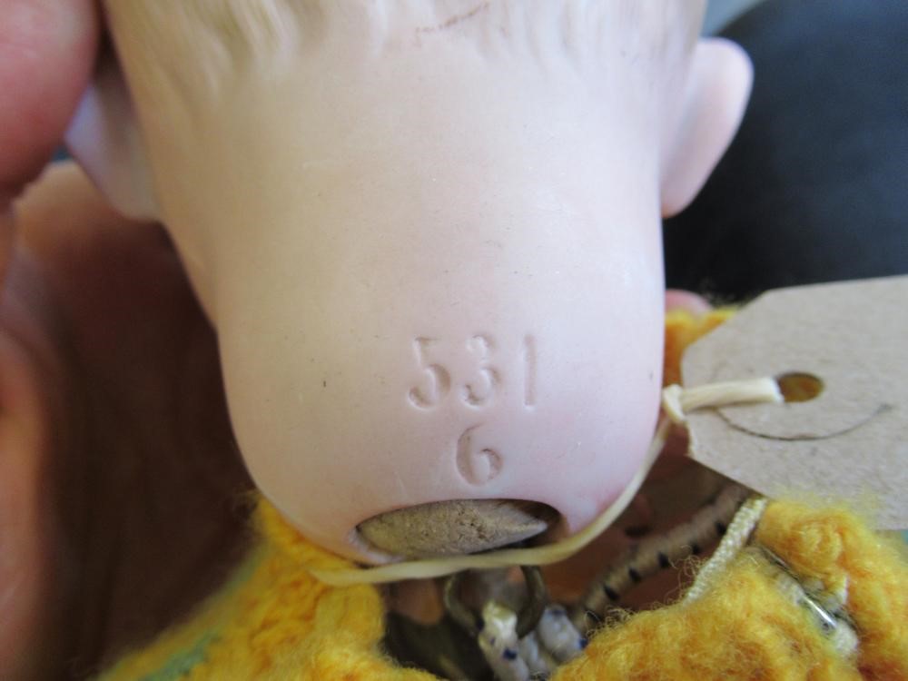 A Kley & Hahn bisque socket head baby doll with painted eyes Image