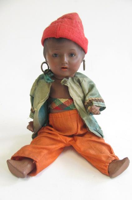 A Heubach & Koppelsdorf bisque socket head doll with brown glass fixed eyes Image