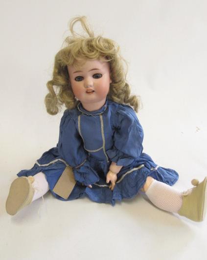A Simon & Halbig bisque socket head doll with blue glass sleeping eyes Image
