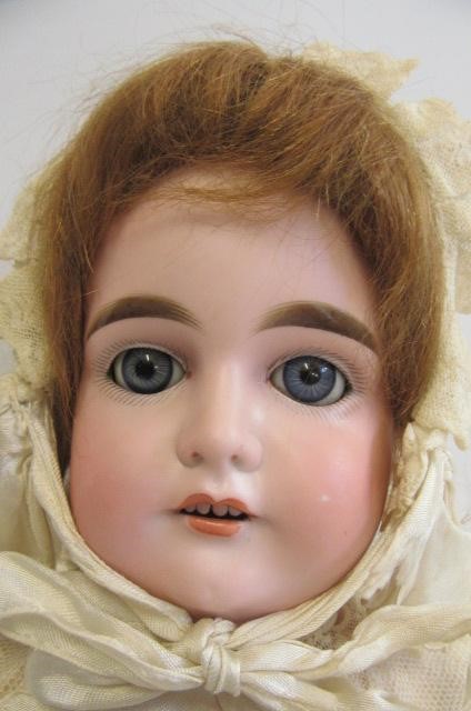 A Cuno & Otto Dressel bisque shoulder head doll Image