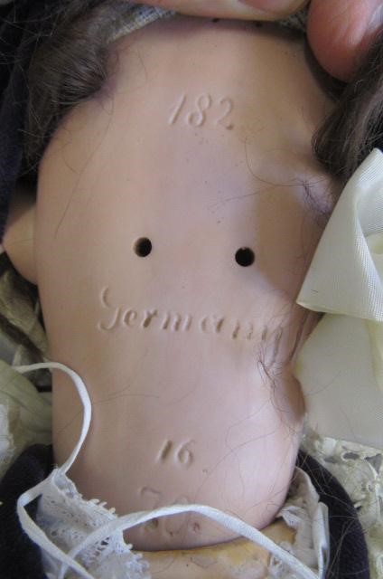 A Kestner bisque socket head doll with brown glass sleeping eyes Image