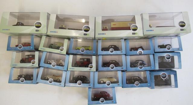 Twenty three Oxford diecast 1:76 scale vehicles including cars Image