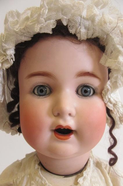 A Schutzmeister & Quendt bisque socket head character doll with blue glass sleeping eyes Image