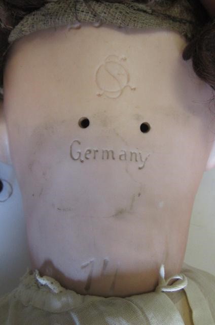 A Schutzmeister & Quendt bisque socket head character doll with blue glass sleeping eyes Image