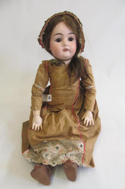 A Max Handwerck bisque socket head doll with brown glass sleeping eyes Image