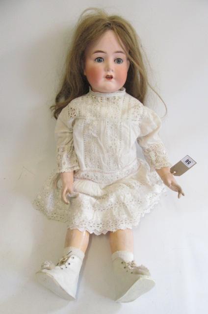 A Cuno & Otto Dressel bisque socket head doll with blue glass sleeping eyes Image