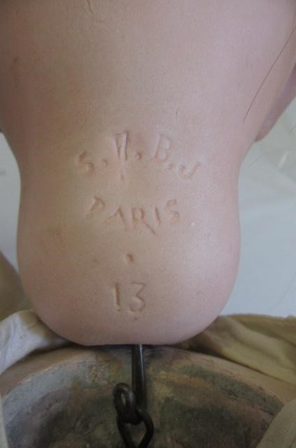 An S.F.B.J. bisque socket head doll with blue glass eyes Image