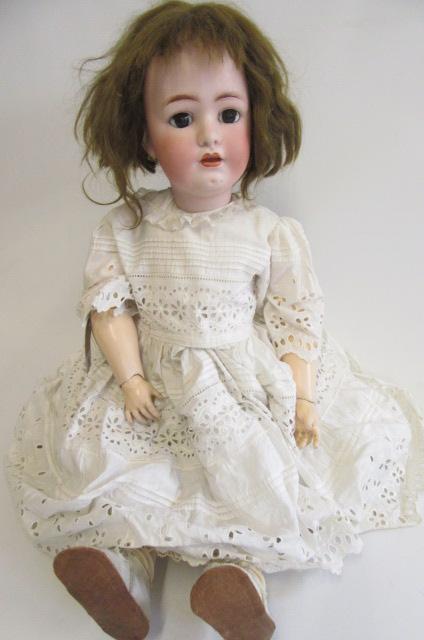 A Franz Schmidt & Co. bisque socket head doll with brown glass sleeping eyes Image