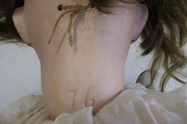 A Franz Schmidt & Co. bisque socket head doll with brown glass sleeping eyes Image