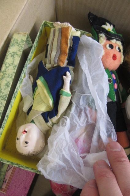 A collection of twelve small dolls including a Herman Steiner bisque socket head doll Image