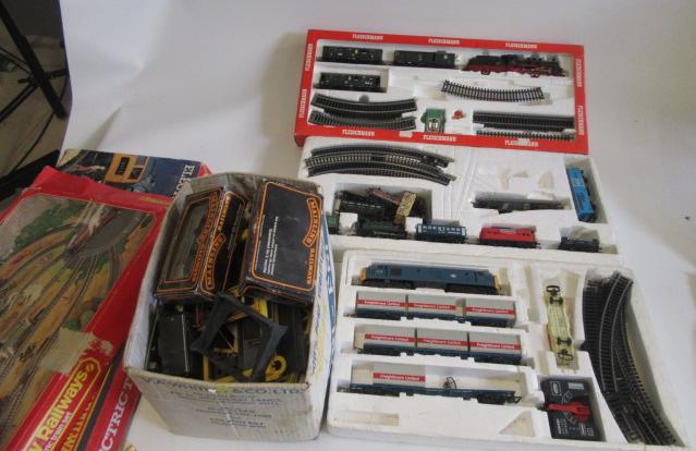 Three playworn train sets comprising Hornby Freight Liner Image