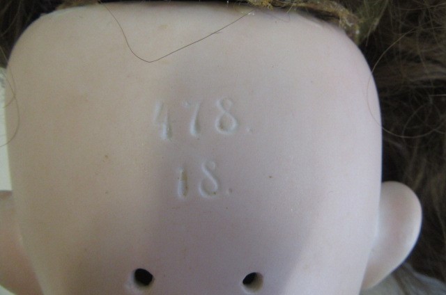 A bisque socket head doll Image