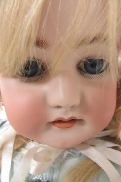 A large Simon & Halbig bisque socket head doll with blue glass sleeping eyes Image