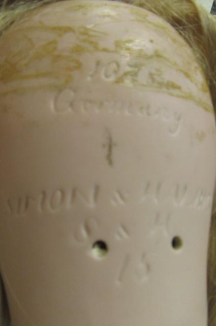 A large Simon & Halbig bisque socket head doll with blue glass sleeping eyes Image