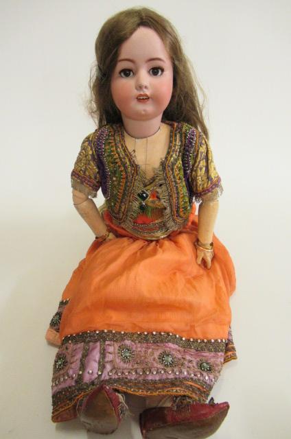 A large Simon & Halbig bisque socket head doll with brown glass sleeping eyes Image