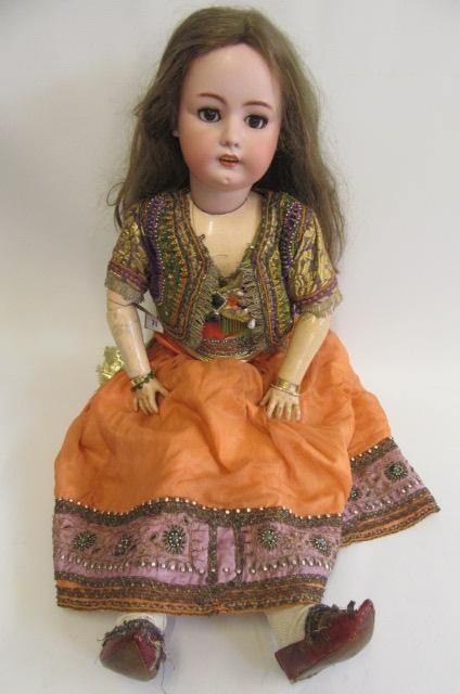 A large Simon & Halbig bisque socket head doll with brown glass sleeping eyes Image